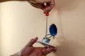 Fixing light switch Royalty Free Stock Photo