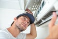 Fixing and maintaining air conditioning system Royalty Free Stock Photo