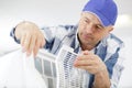 fixing and maintaining air conditioning system Royalty Free Stock Photo