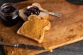 Peanut Butter and Jelly Sandwich on a Wooden Kitchen Counter Royalty Free Stock Photo