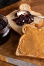 Peanut Butter and Jelly Sandwich on a Wooden Kitchen Counter Royalty Free Stock Photo