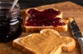 Peanut Butter and Jelly Sandwich on a Wooden Kitchen Counter Royalty Free Stock Photo
