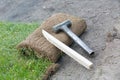 Fixing rolled sod grass turf on soil Royalty Free Stock Photo