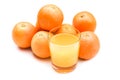 Fizzy orange juice from effervescent tablet with oranges at backdrop Royalty Free Stock Photo