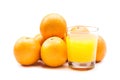 Fizzy orange juice from effervescent tablet with oranges at backdrop Royalty Free Stock Photo