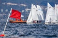 FJ sailboats line up on the start line of a collegiate sailing regatta in English Bay, Vancouver
