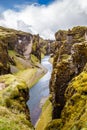 Fjadrargljufur canyon steep cliffs and waters of Fjadra river, s