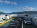 Fjaerland, Norway, September 8, 2019: View from a ferry boat over the Sognefjord and the boat deck with young woman Royalty Free Stock Photo