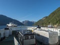 Fjaerland, Norway, September 8, 2019: View from a ferry boat over the Sognefjord and the boat deck and Gulen - Fjord1