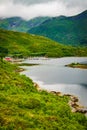 Fjord landscape with fishing boats in port Royalty Free Stock Photo