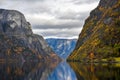 Fjord and Mountains in the autumn season that reflect the water in Norway Royalty Free Stock Photo