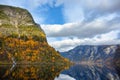 Fjord and Mountains in the autumn season that reflect the water in Norway Royalty Free Stock Photo