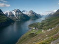 Fjord during spring sunset with calm waters - AI Generated