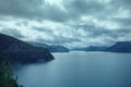 Fjord at sunset. Rocky shore in evening Royalty Free Stock Photo