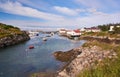 Fjord surrounded by buildings, boats moored Royalty Free Stock Photo