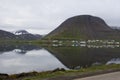 Fjord view, western Fjords, iceland. Water reflection small village remote ocean inlet.