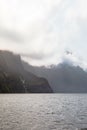 FjordLand National Park. View of sheer cliffs among the clouds. New Zealand