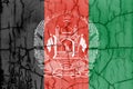 Flag of Afghanistan on cracked wall, textured background. Royalty Free Stock Photo