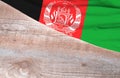 Flag Afghanistan and space for text on a wooden background