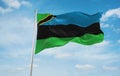 flag of African Arabs Zanzibaris at cloudy sky background, panoramic view.flag representing ethnic group or culture, regional