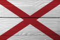 Flag of Alabama on wooden wall background. Grunge Alabama flag texture, The states of America.