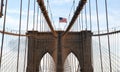 Flag of America winding on top of Brooklyn Bridge Royalty Free Stock Photo