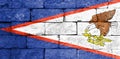 Flag of American Samoa on old brick wall. Royalty Free Stock Photo