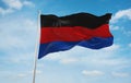 flag of Anglo-Frisian peoples East Frisians at cloudy sky background, panoramic view.flag representing ethnic group or culture,