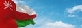 flag of Arab peoples Omanis at cloudy sky background, panoramic view.flag representing ethnic group or culture, regional