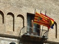 Flag of Aragon community, Spain and EU waving on the balcony of public city hall downtown in Zaragoza, Spain. Spanish heraldic Royalty Free Stock Photo