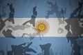 flag of argentina on the khaki texture . military concept