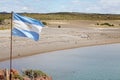 Flag of Argentina at Punta Tombo in the Atlantic Ocean, Patagonia, Argentina