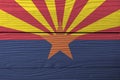 Flag of Arizona on wooden wall background. Grunge Arizona flag texture, The states of America. Royalty Free Stock Photo