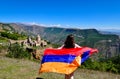 Flag of Armenia on the background of Tatev Monastery