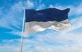 flag of Assen , Netherlands at cloudy sky background on sunset, panoramic view. Dutch travel and patriot concept. copy space for