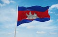 flag of Austroasiatic peoples Cambodians Khmer people at cloudy sky background, panoramic view.flag representing ethnic group or