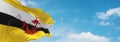 flag of Austronesian peoples Bruneians at cloudy sky background, panoramic view.flag representing ethnic group or culture,