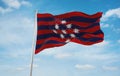 flag of Austronesian peoples Minahasans at cloudy sky background, panoramic view.flag representing ethnic group or culture,