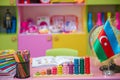 Flag of Azerbaijan for a small table . Kindergarten background . Baku , Azerbaijan . Blurred view of empty playroom