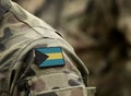 Flag of the Bahamas on military uniform. Commonwealth of the Bahamas. Collage Royalty Free Stock Photo