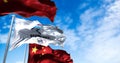 The flag of Beijing 2022 waving in the wind with the national flags of China
