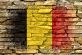 Flag of Belgium. Flag is painted on a stone wall. Stone background. Copy space. Textured background Royalty Free Stock Photo
