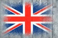 Flag of Britain. Flag is painted on a gray wooden plank surface. Wooden background. Plywood surface. Copy space. Textured Royalty Free Stock Photo