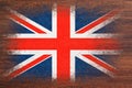 Flag of Britain. Flag is painted on a wooden surface. Wooden background. Plywood surface. Copy space. Textured background Royalty Free Stock Photo