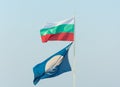 Flag of Bulgaria and a clean beach against a blue sky Royalty Free Stock Photo