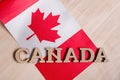 Flag of Canada, the word Canada in wooden abstract letters Royalty Free Stock Photo