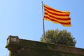 Flag of Catalonia on Montjuic castle, Barcelona, Spain Royalty Free Stock Photo