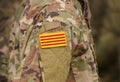 Flag of Catalonia Senyera on military uniform. Collage