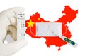 Flag of China with face mask, positive covid test and thermometer. Zero covid in China.