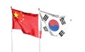 Flag of China flag and South Korea. Flying flag on the cloudy sky. waving in the sky Royalty Free Stock Photo